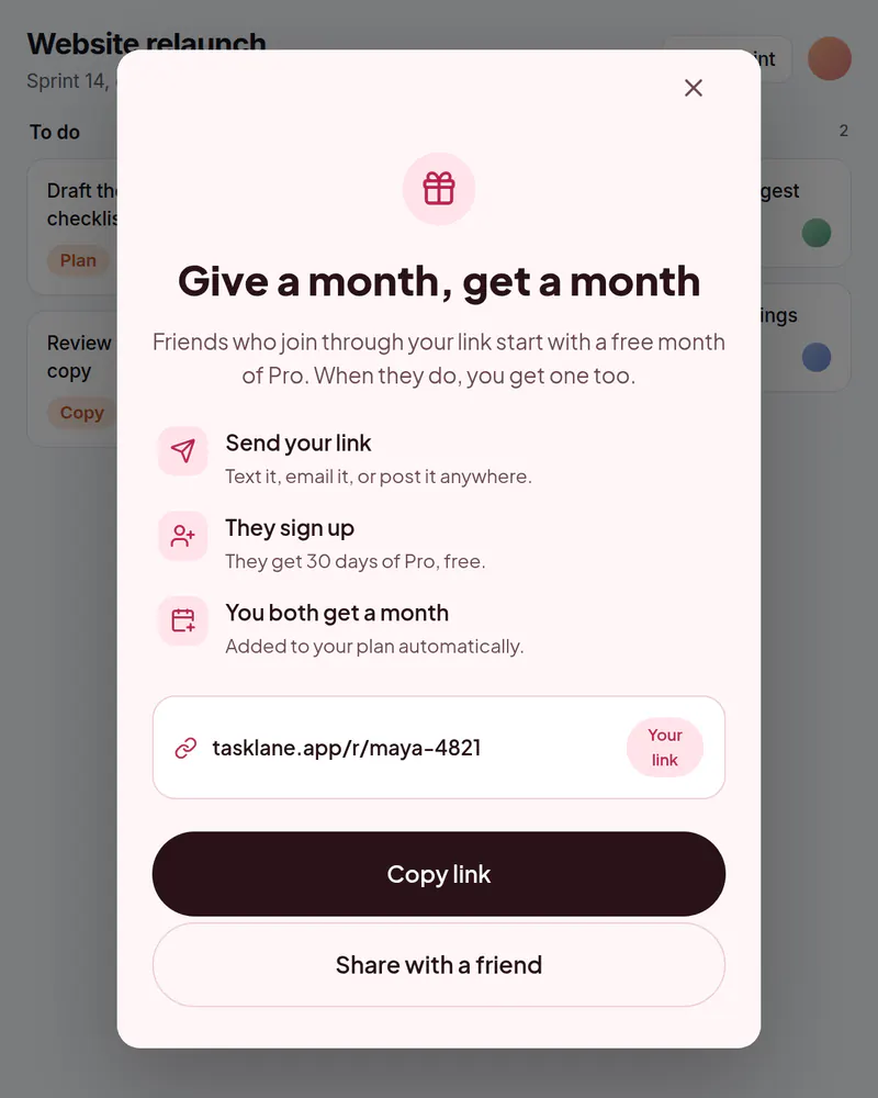 A popup over a task board titled Give a month, get a month, with a personal invite link and a Copy link button